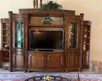 Stunning 7-piece lighted entertainment center with turned wood accents
