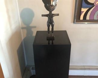 African sculpture & Pair of black pedestals