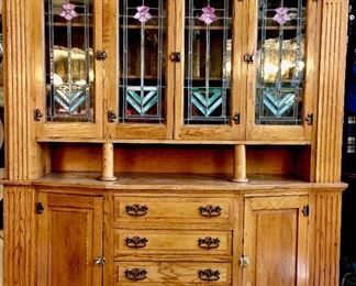1900’s Arts and Crafts two part buffet. Four stained glass panels. Solid oak. $2,200
