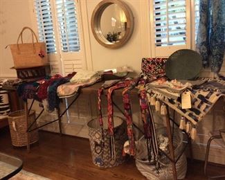 Round elm wooden mirror, canvas baskets,  handmade textiles, 8-foot antique wallpaper table.