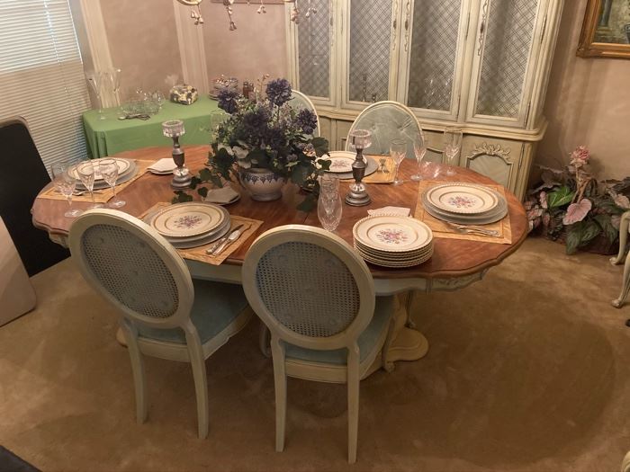 Dining table with chairs and matching china hutch. 