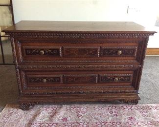 Two drawer walnut chest in maple and ebony inlays, intricate carved details, distressed finish, made in Italy.