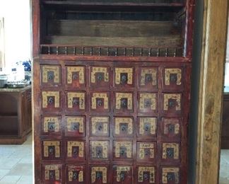 Antique Chinese apothecary chest with multiple drawers.