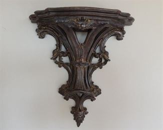 Italian hand carved wood wall bracket with fretwork design in an antique silver gilt finish.