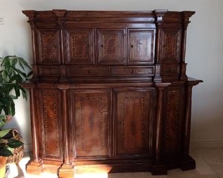 Hand carved credenza and hutch with doors and drawers, featuring intricate inlay patterns and decorative metal reliefs on the inside, made in Italy.