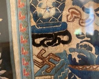 Embroidered swastika  (symbol of longevity) on Qing Dynasty silk sleeve.