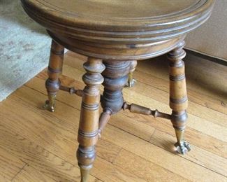 Antique claw foot piano stool