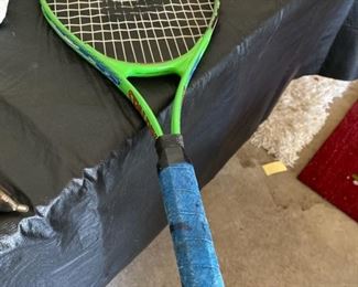 three tennis raquets