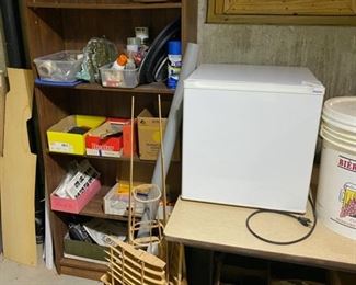 small refrigerator and wine making items