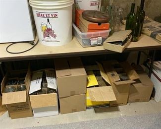 Wine making buckets and chemicals and bottles