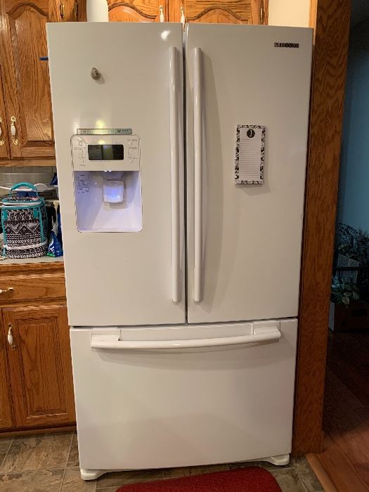 Samsung LG French door refrigerator with icemaker; measurements are 60" High, 32" deep, 36" wide