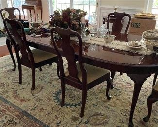 BEAUTIFUL HENREDON DINING ROOM TABLE IS 64" LONG AND HAS 2-20" LEAVES-EXTENDS TO 108" AND HAS 6 CHAIRS AND ALL PADS