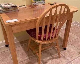 THE TABLE IS SOLID MAPLE WITH DROP LEAF ON 1 SIDE