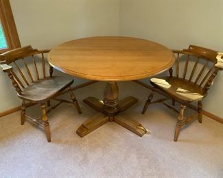 Vintage Conant Ball rock maple dining set.  44” diameter as shown.  Expands to 68” long with two 12” leaves.  Comes with four stationary side chairs and two swivel captains chairs