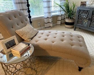 Gorgeous tufted chaise lounge upholstered in a neutral, versatile color.