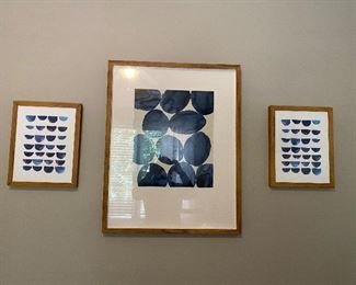 Three teal prints in wood frames