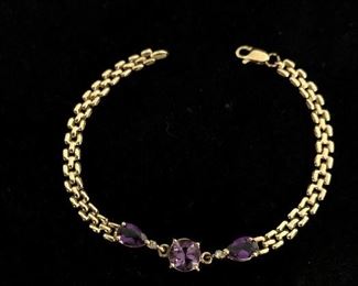 14k gold bracelet with Amethysts.