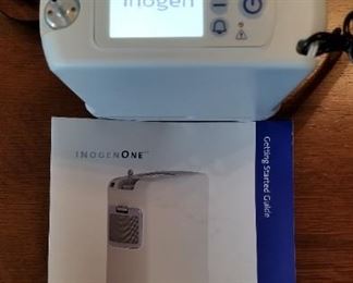 Inogen One G4 portable oxygen concentrator with 3 batteries and case. Appears fully operational.