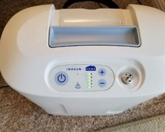 Inogen at Home oxygen concentrator. Appears fully operational.