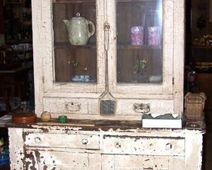 White 2 pc. primitive cupboard, advertising