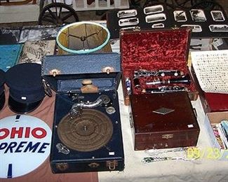 Old photos, table top phono, clarinet, postcards, SOHIO glass gas pump face (repro), etc..