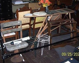 Black cast iron bed, wood ironing board, shelf, etc..