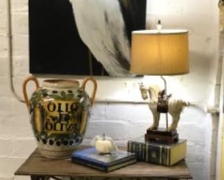 Antique window railing upcycled into table, huge heron print, equestrian lamp and large olive jar