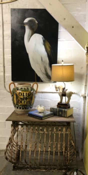 Antique window railing upcycled into table, huge heron print, equestrian lamp and large olive jar