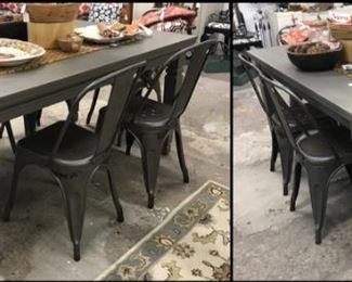 Sturdy gray dining table. Metal bistro chairs. 