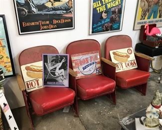 Movie theater seats and posters. 