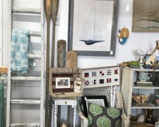 Old ladder, oars, vintage wicker chair, beach decor. 