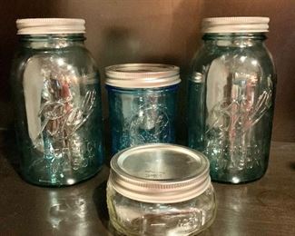 $30 - Set of four Ball canning jars with lids. (2) 7"H , 5"H and 2"H