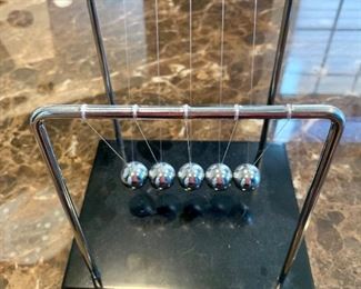 $20 - Newton's cradle with five balls 7"H x 6"D x 7"W