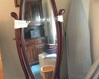 Stand-up mirror and ironing board.