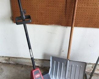 Snow blower and shovels.