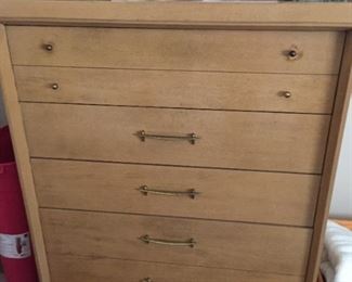 Chest of drawers and linens.
