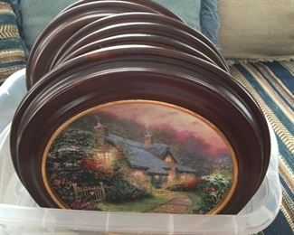 Thomas Kinkade plates with wooden frames.