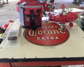 Carport items - tall pub table With Corona logo on top