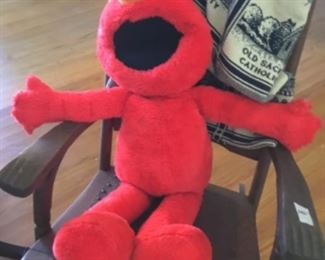 Elmo in rocking chair - inside house