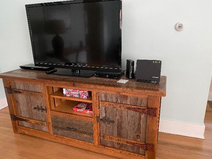 Beautiful handcrafted entertainment center from Woodland Creek Interiors