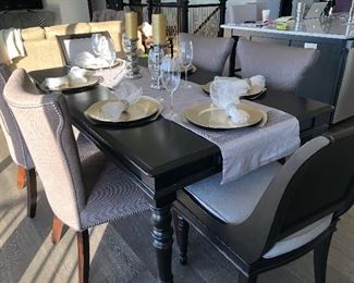 #2) - $750  Solid Wood Black Dining Table with 6 Chairs.  4 Matching Upholstered Chairs with Nailhead Trim and 2 Complimentary Chairs  72w x 42d x 30h.  This item may not be picked up until Wednesday, Oct 14 between 3:00 and 7:00 p.m.