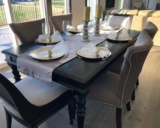 #2) - $750  Solid Wood Black Dining Table with 6 Chairs.  4 Matching Upholstered Chairs with Nailhead Trim and 2 Complimentary Chairs  72w x 42d x 30h.  This item may not be picked up until Wednesday, Oct 14 between 3:00 and 7:00 p.m.