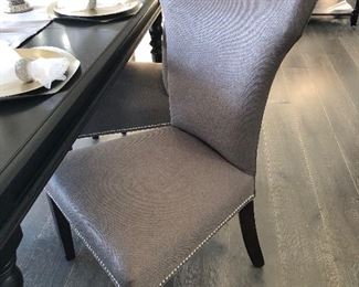 #2) - $750  Solid Wood Black Dining Table with 6 Chairs.  4 Matching Upholstered Chairs with Nailhead Trim and 2 Complimentary Chairs  72w x 42d x 30h.  This item may not be picked up until Wednesday, Oct 14 between 3:00 and 7:00 p.m.