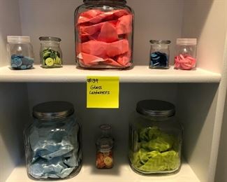 #139) $20 - Assortment of Glass Containers with various contents.