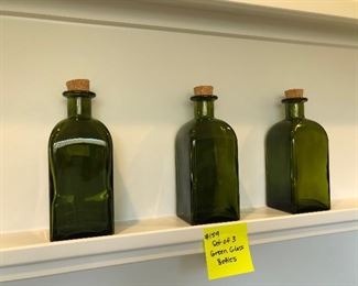 #159) $15 - Set of 3 Green Glass Bottles.