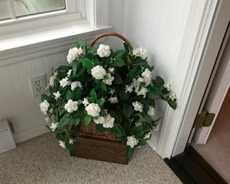 Fake flower arrangement in basket