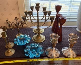 Collection of Vintage Brass candlesticks and candelabras $40: Two Blue Glass Kosta Boda Sweden candle holders $35 pr.; 3 Mid Century Wooden candle holders $30, Towle Sterling Candle Holders $45