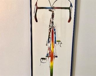 $30 Framed John Wibberley bicycle poster.  13" W x 34.5" H.  