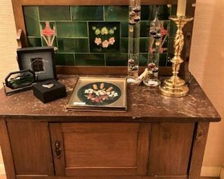 Antique wash stand with green tile back
