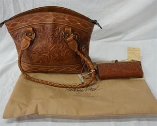 1019 PATRICIA NASH EMBOSSED LEATHER BAG AND WALLET, BAG HAS NO VISIBLE WEAR WITH CLOTH STORAGE BAG AND WALLET IS NEW WITH TAGS, 14 IN X 11 IN X 4 IN